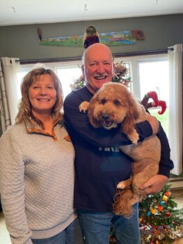 Image of Dale and Linda Dodd with dog Maverick.