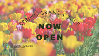 Image of a field of tulips with the text about Spring Grant Cycle accepting applications.